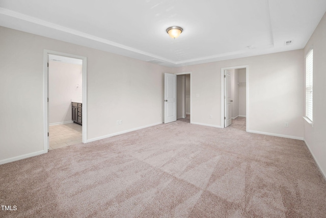 1103 Laurel Twist Rd, Cary, NC 27513 - unfurnished bedroom featuring carpet, a walk in closet, and baseboards