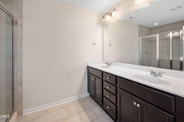 1103 Laurel Twist Rd, Cary, NC 27513 - full bathroom with double vanity, a stall shower, baseboards, and tile patterned floors