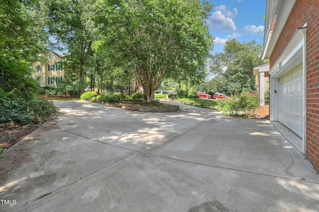 123 W Camden Forest Dr, Cary, NC 27518 - view of patio with concrete driveway and a garage