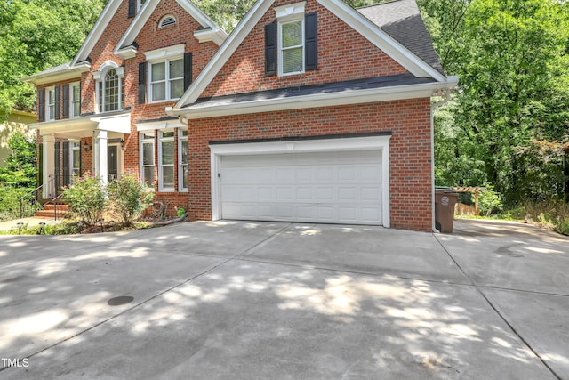 123 W Camden Forest Dr, Cary, NC 27518 - view of front of home with brick siding, concrete driveway, and a shingled roof