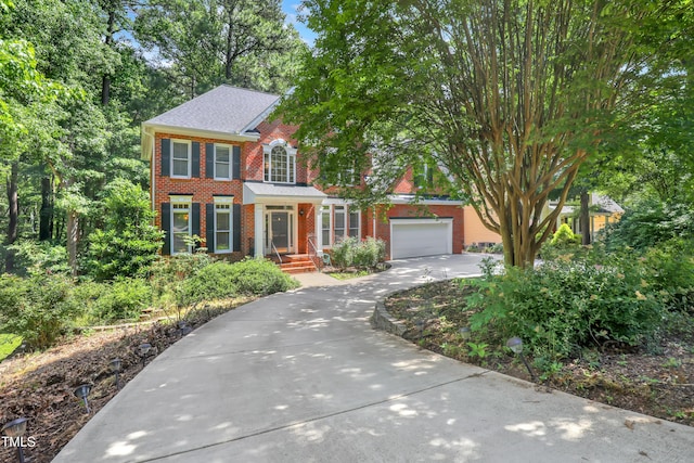 123 W Camden Forest Dr, Cary, NC 27518 - view of front of house with concrete driveway and brick siding