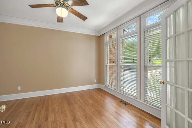 123 W Camden Forest Dr, Cary, NC 27518 - empty room featuring crown molding, baseboards, light wood finished floors, and ceiling fan