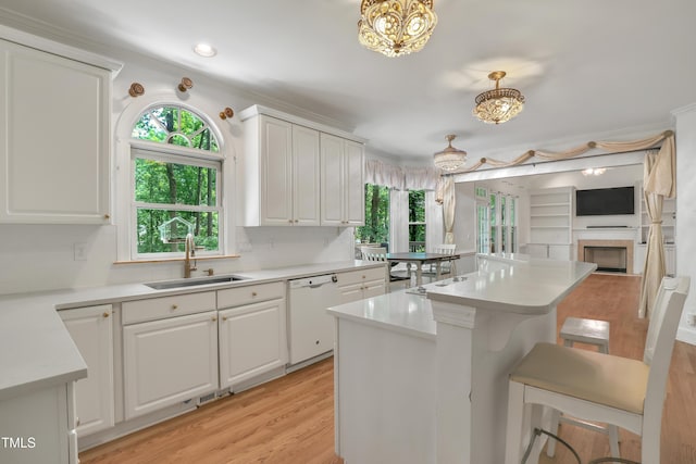 123 W Camden Forest Dr, Cary, NC 27518 - kitchen with a sink, dishwasher, a kitchen bar, healthy amount of natural light, and recessed lighting