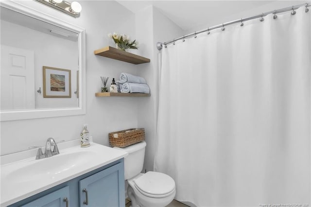 full bath with toilet and vanity