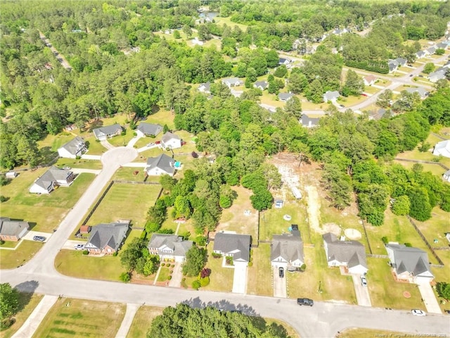 aerial view of property and surrounding area with nearby suburban area