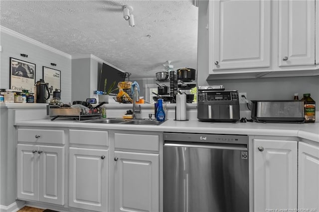 kitchen featuring dishwasher, a sink, a textured ceiling, white cabinets, and light countertops