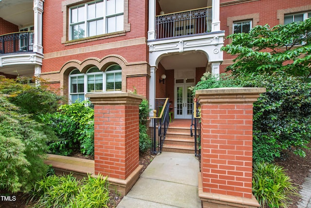 710 Independence Pl Unit 103, Raleigh, NC 27603 - entrance to property with french doors, a balcony, and brick siding