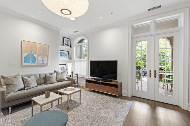 710 Independence Pl Unit 103, Raleigh, NC 27603 - living room featuring french doors, wood-type flooring, crown molding, and recessed lighting