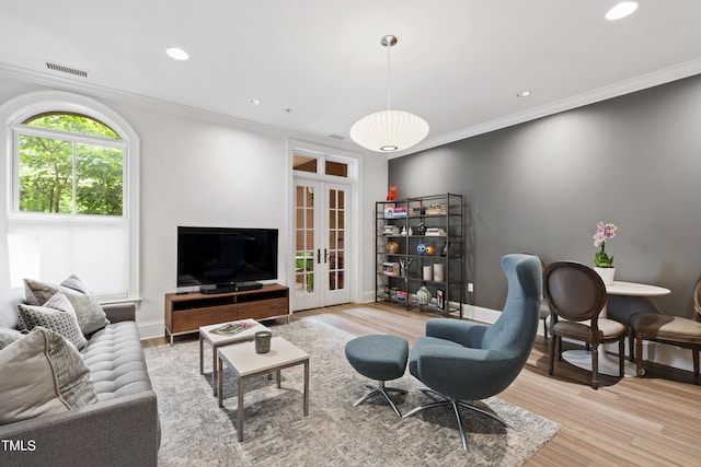710 Independence Pl Unit 103, Raleigh, NC 27603 - living area with french doors, ornamental molding, wood finished floors, recessed lighting, and baseboards