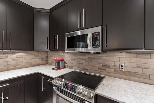 710 Independence Pl Unit 103, Raleigh, NC 27603 - kitchen with appliances with stainless steel finishes, decorative backsplash, ornamental molding, and light stone countertops