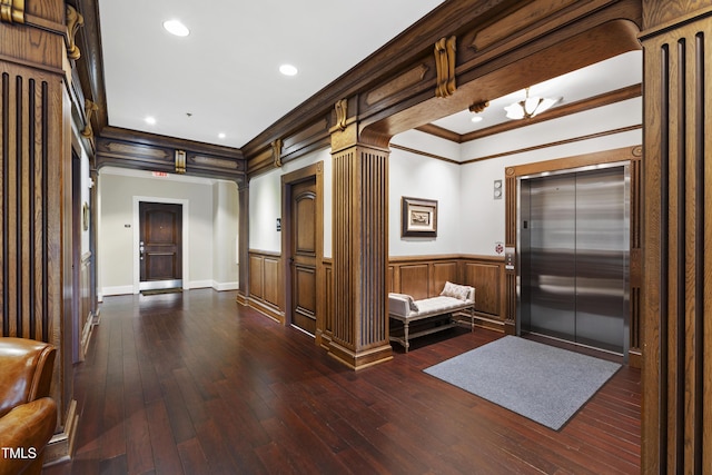 710 Independence Pl Unit 103, Raleigh, NC 27603 - entrance foyer with elevator, ornamental molding, wainscoting, dark wood finished floors, and recessed lighting