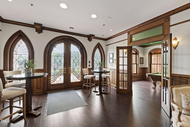 710 Independence Pl Unit 103, Raleigh, NC 27603 - foyer entrance featuring french doors, a wainscoted wall, crown molding, billiards, and dark wood-style floors