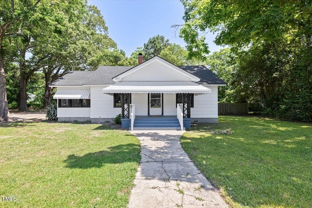 201 Van St, Pinetops, NC 27864 - bungalow-style home featuring a chimney, crawl space, a porch, and roof with shingles