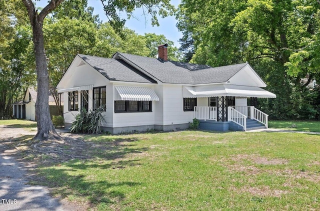 201 Van St, Pinetops, NC 27864 - modern farmhouse style home featuring a chimney, roof with shingles, crawl space, and a front yard
