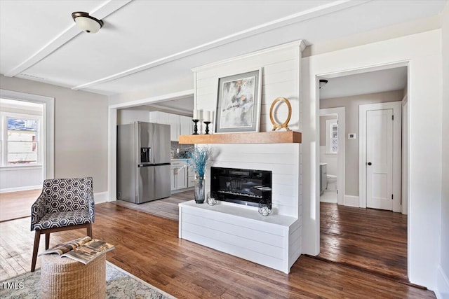 201 Van St, Pinetops, NC 27864 - living room with wood finished floors, baseboards, and a glass covered fireplace