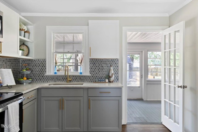 201 Van St, Pinetops, NC 27864 - kitchen with gray cabinets, a sink, plenty of natural light, tasteful backsplash, and crown molding