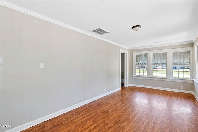 201 Van St, Pinetops, NC 27864 - empty room with wood finished floors, crown molding, and baseboards