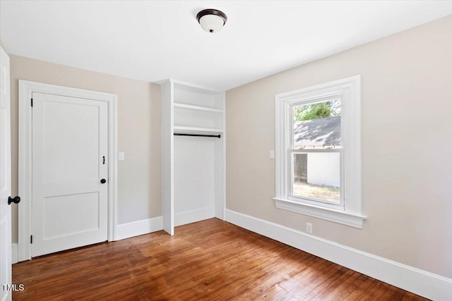 201 Van St, Pinetops, NC 27864 - unfurnished bedroom with wood finished floors, baseboards, and a closet