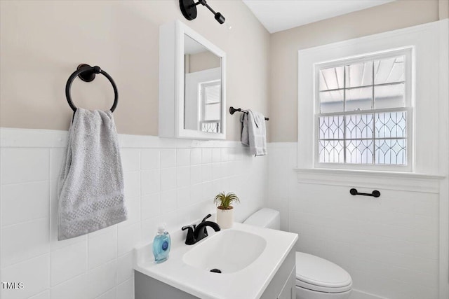 201 Van St, Pinetops, NC 27864 - half bath with tile walls, toilet, vanity, and wainscoting