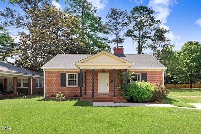 905 S 1st St, Smithfield, NC 27577 - view of front of home with brick siding, a front yard, a chimney, and crawl space