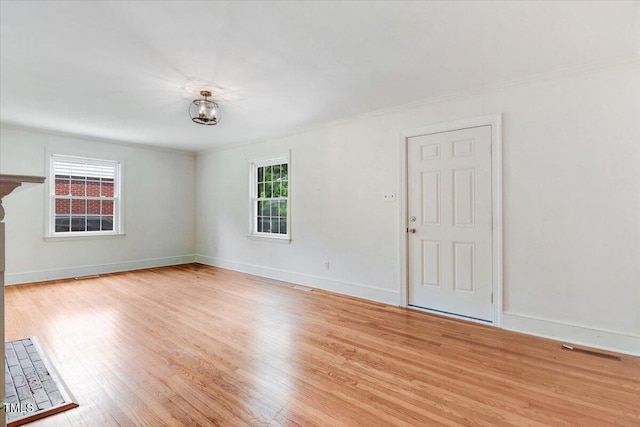 905 S 1st St, Smithfield, NC 27577 - unfurnished room with wood finished floors, baseboards, and ornamental molding