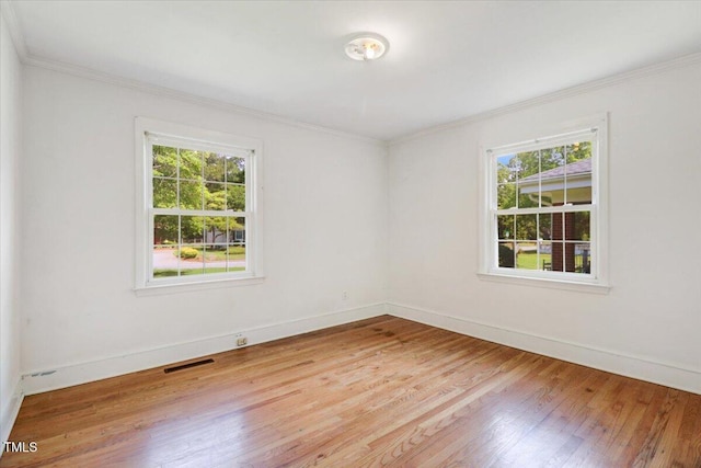 905 S 1st St, Smithfield, NC 27577 - unfurnished room with healthy amount of natural light, wood finished floors, ornamental molding, and baseboards