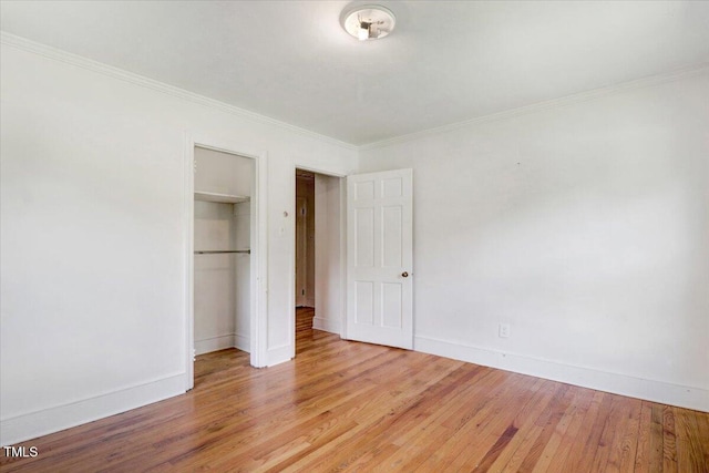 905 S 1st St, Smithfield, NC 27577 - unfurnished bedroom with light wood-style floors, baseboards, a closet, and ornamental molding
