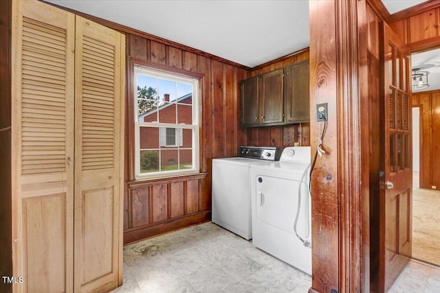 905 S 1st St, Smithfield, NC 27577 - laundry area featuring cabinet space, wood walls, and washer and dryer