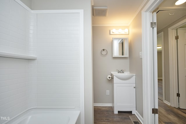 107 Rencher St, Hillsborough, NC 27278 - bathroom featuring wood finished floors, vanity, ornamental molding, baseboards, and bathtub / shower combination