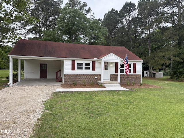 6300 NC-27, Coats, NC 27521 - view of front of property with driveway, a carport, a front lawn, and brick siding