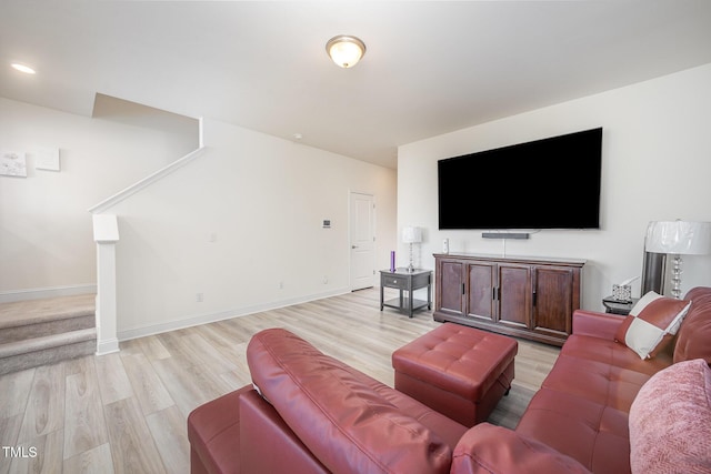 113 Blandford St, Franklinton, NC 27525 - living room with light wood-type flooring, stairs, and baseboards
