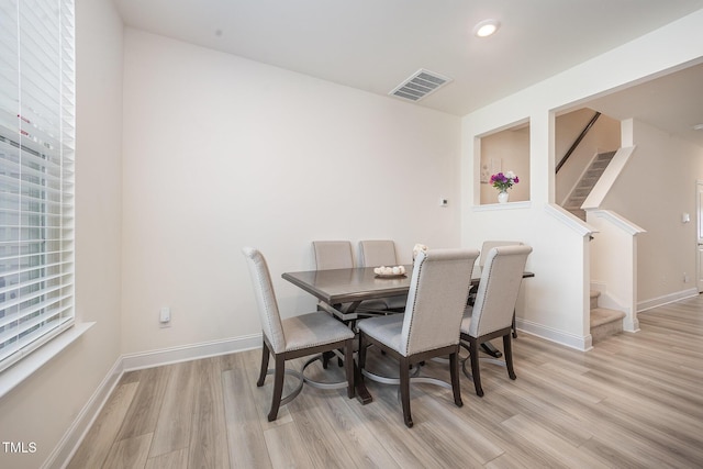 113 Blandford St, Franklinton, NC 27525 - dining space featuring light wood finished floors, stairs, and baseboards