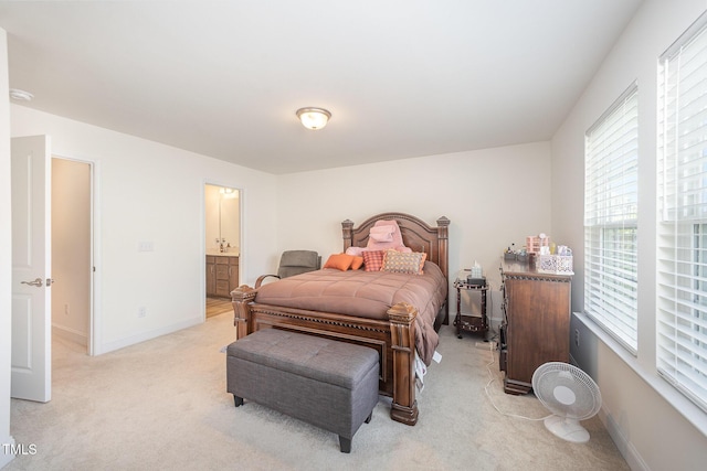 113 Blandford St, Franklinton, NC 27525 - bedroom featuring light colored carpet, baseboards, and ensuite bathroom
