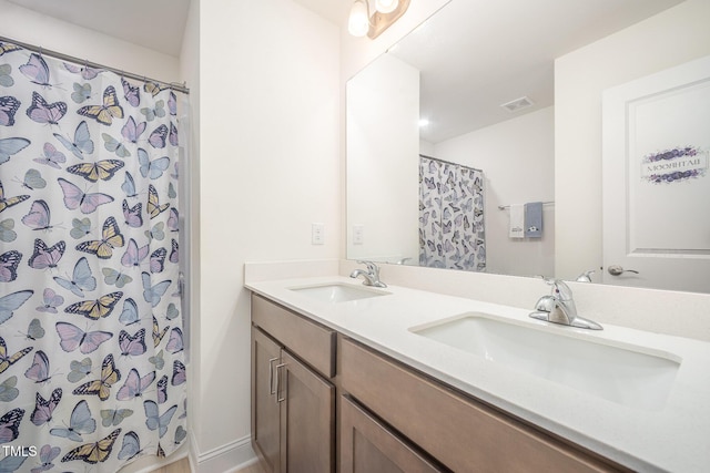 113 Blandford St, Franklinton, NC 27525 - full bathroom with double vanity and a shower with shower curtain