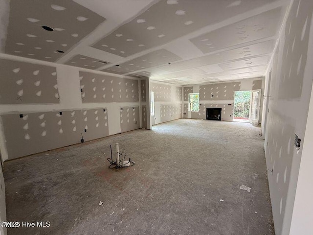 unfurnished living room featuring a fireplace