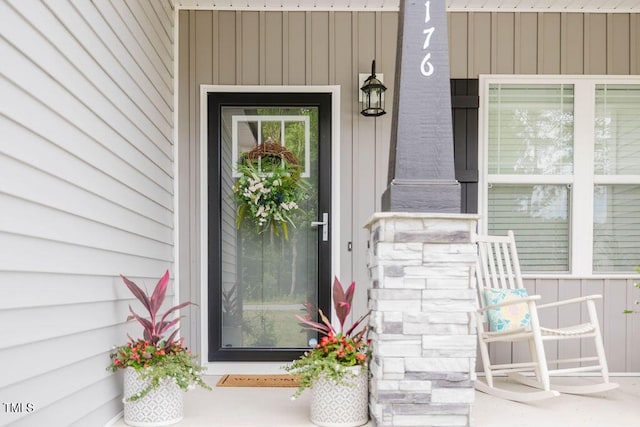 176 Lowery Ln, Benson, NC 27504 - property entrance with a porch and board and batten siding