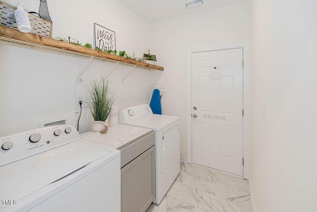 176 Lowery Ln, Benson, NC 27504 - laundry room with light marble finish floors and separate washer and dryer