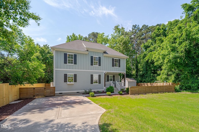 3003 University Dr, Durham, NC 27707 - view of front of property featuring board and batten siding, crawl space, and a porch