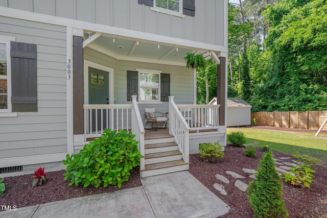 3003 University Dr, Durham, NC 27707 - view of exterior entry featuring board and batten siding, covered porch, and crawl space