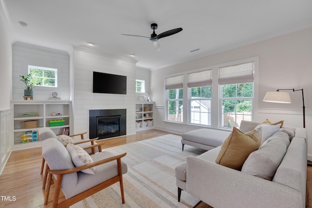 3003 University Dr, Durham, NC 27707 - living area featuring light wood-style flooring, ceiling fan, and a fireplace