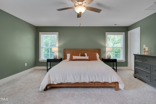 3003 University Dr, Durham, NC 27707 - bedroom with light carpet, baseboards, and a ceiling fan
