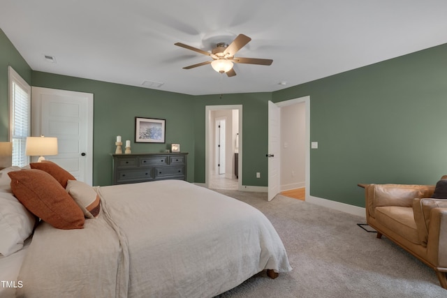 3003 University Dr, Durham, NC 27707 - bedroom featuring light carpet, baseboards, and ceiling fan
