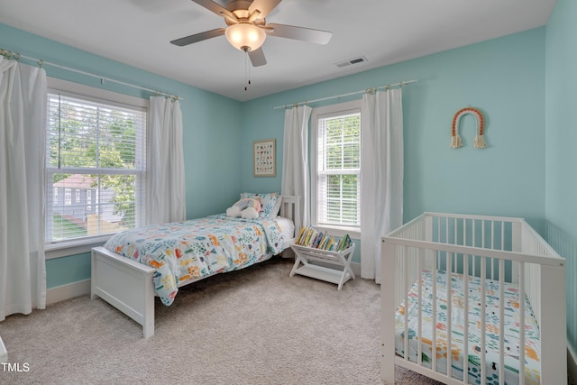 3003 University Dr, Durham, NC 27707 - carpeted bedroom with baseboards and ceiling fan