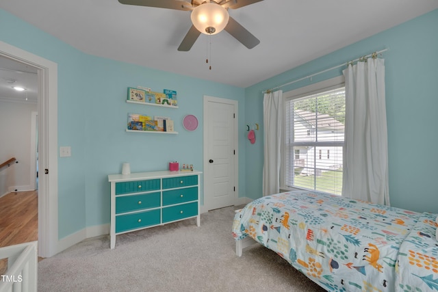 3003 University Dr, Durham, NC 27707 - bedroom with baseboards, light carpet, and a ceiling fan