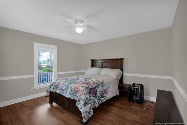 bedroom with wood finished floors, baseboards, and a ceiling fan