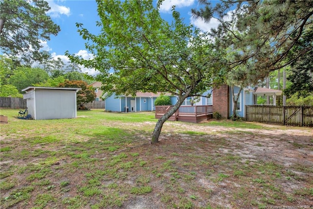 view of yard with a wooden deck