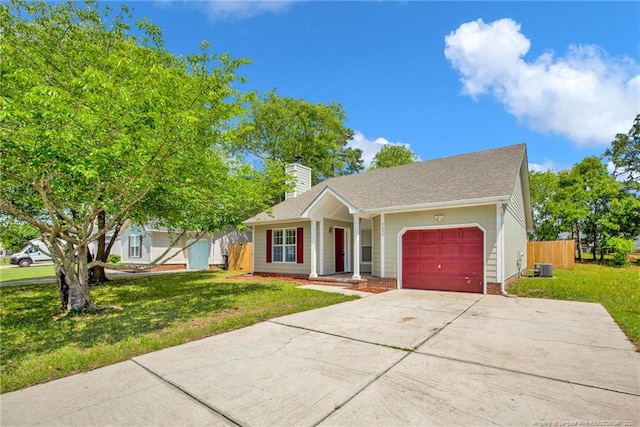 ranch-style house with a garage, a chimney, concrete driveway, and central AC