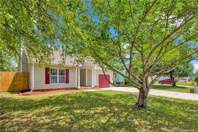 view of front of property with concrete driveway and a garage