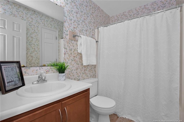 bathroom featuring wallpapered walls, toilet, vanity, tile patterned floors, and curtained shower