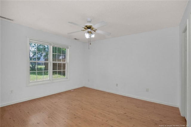 unfurnished room featuring light wood finished floors, baseboards, and a ceiling fan